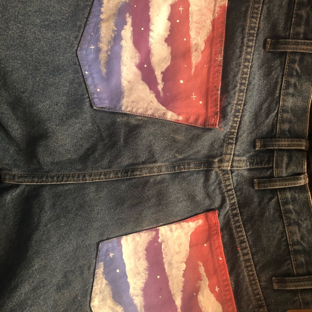 Clouds and stars on medium wash denim jeans